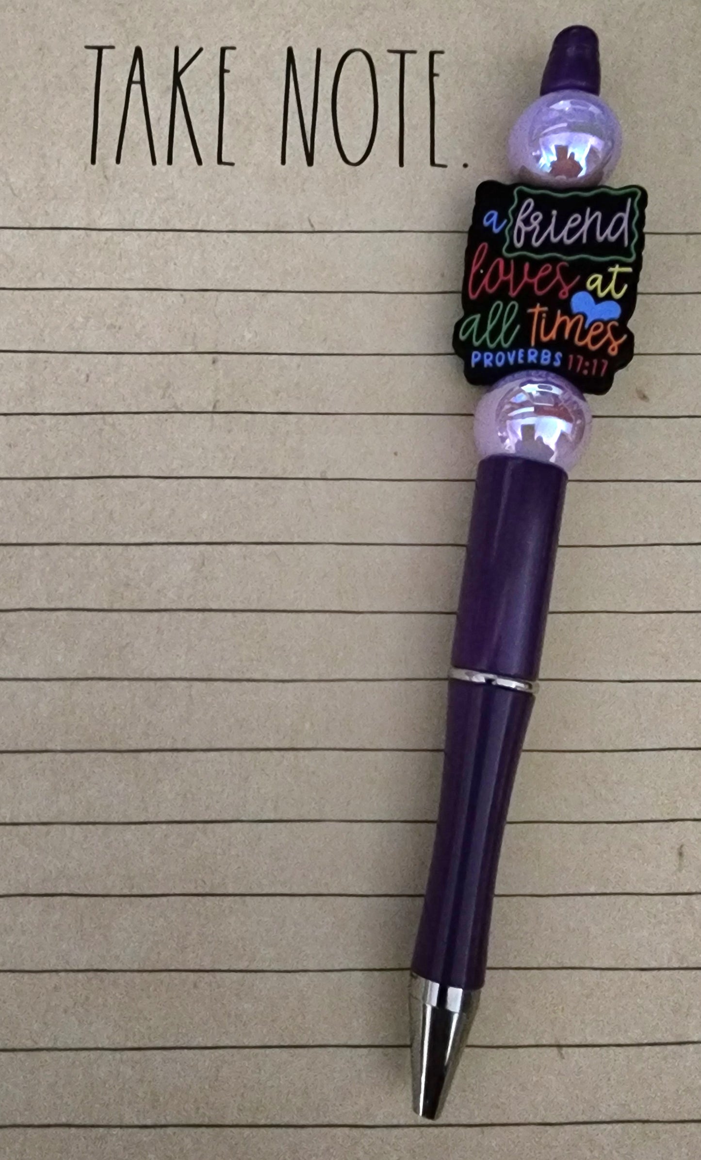 A Friend Loves at All Times with Glossy Lilac Acrylic Beads on Dark Purple Pen